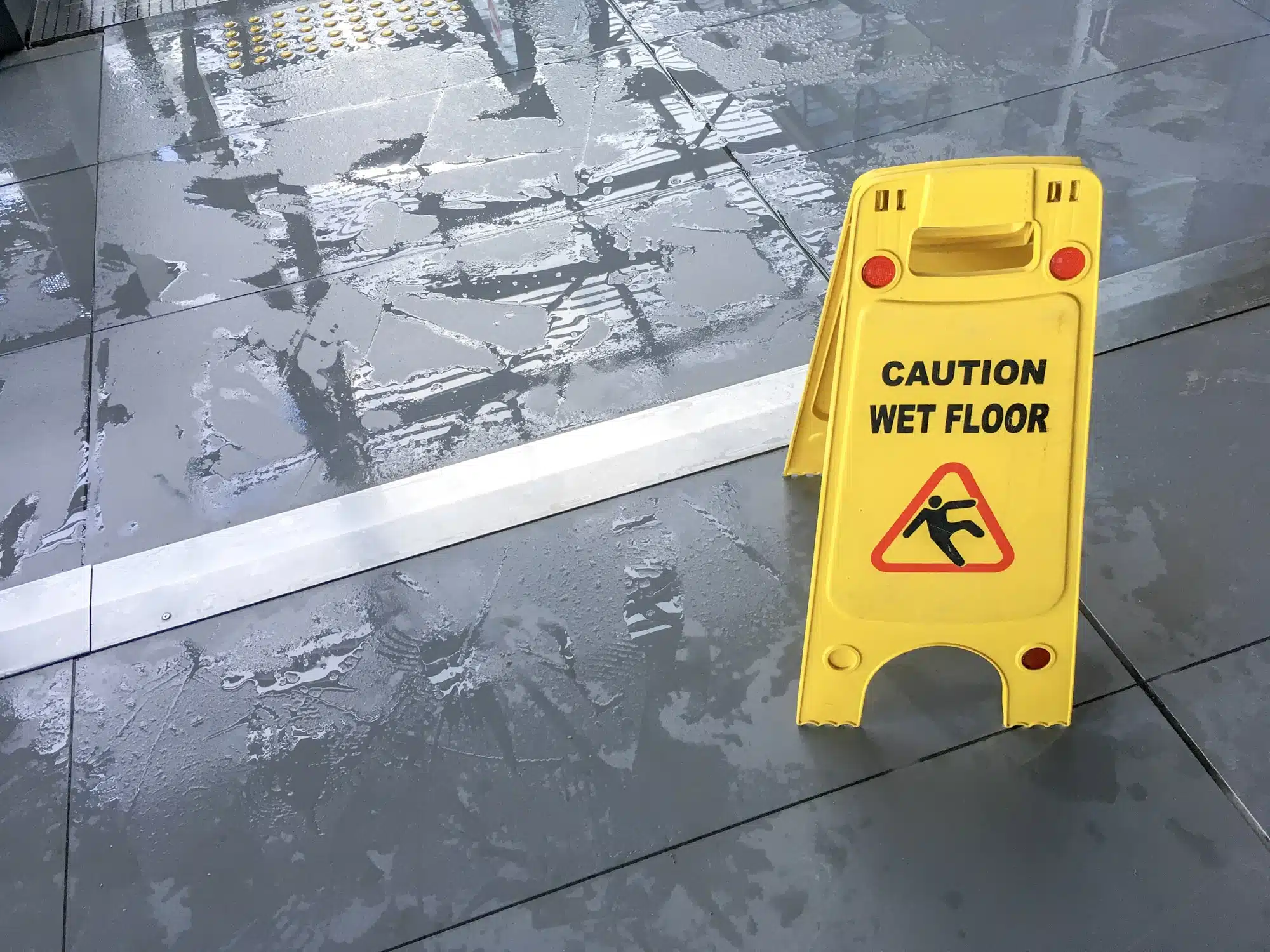 Wet floor sign on slippery floor