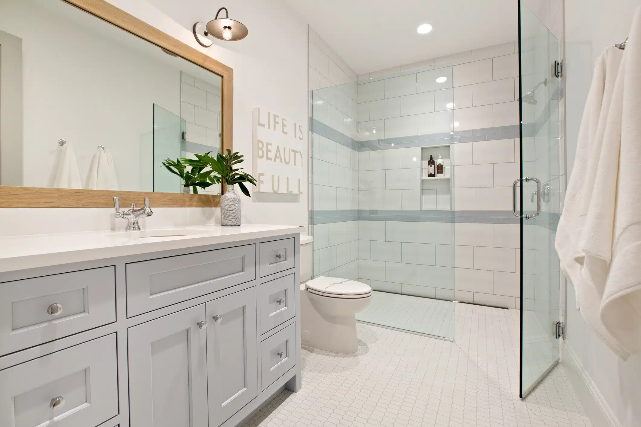 Modern bathroom with basin vanity and shower showing non-slip floor tiles for bathroom